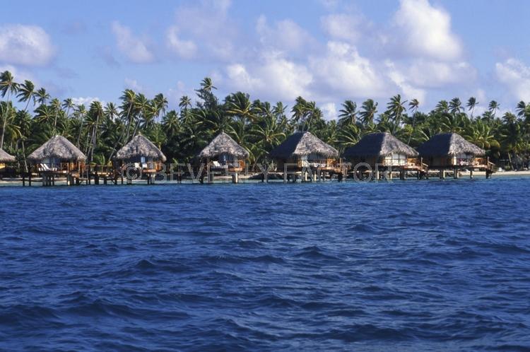 Islands;huts;ocean;palm trees;blue;water;sky;manihi;french polynesia